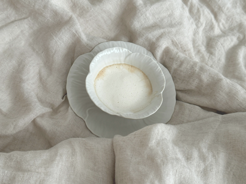 warm latte on a bed